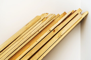 Wooden boards. A stack of lumber for the construction of various structures. Close-up. White background