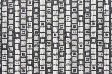 Closeup shot of a gray black square patterned fabric textile surface
