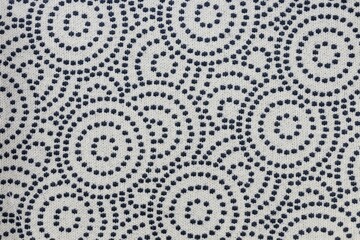 Closeup shot of a blue white circular patterned fabric textile surface