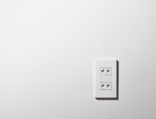electric socket on white wall
