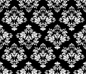 Floral pattern. Vintage wallpaper in the Baroque style. Seamless vector background. White and black ornament for fabric, wallpaper, packaging. Ornate Damask flower ornament