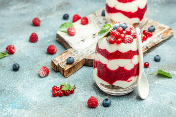 Scottish dessert whipped cream, roasted oatmeal and raspberries in jar. banner, menu, recipe place for text, top view