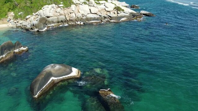 Santa Marta Colombia , Tayrona Natural Park Caribbean sea Cabo San Juan  - Drone aerial view of amazing  sand beach and  forest - Tourist attraction for relax and enjoy the paradise of the ocean sea 