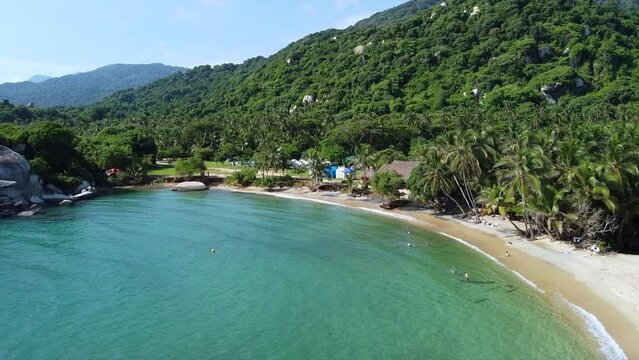 Santa Marta Colombia , Tayrona Natural Park Caribbean sea Cabo San Juan  - Drone aerial view of amazing  sand beach and  forest - Tourist attraction for relax and enjoy the paradise of the ocean sea 