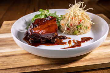 Typical peruvian food and drinks, pork belly with rice and vegetables