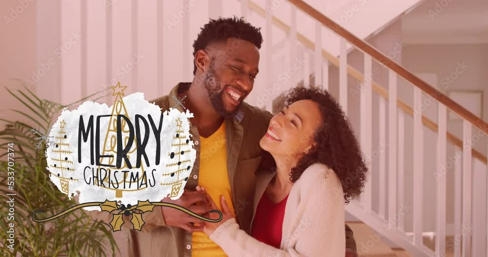 Sticker Animation of merry christmas text over african american couple smiling