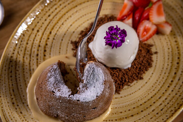 Typical peruvian food and drinks, chocolate volcano dessert with ice cream