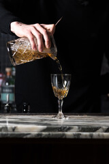 Pouring cocktail into glass