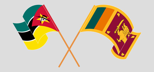 Crossed and waving flags of Mozambique and Sri Lanka