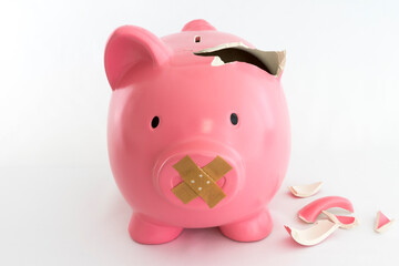 Piggy bank symbol of inflation, economy and crisis. Pink coloured on white background