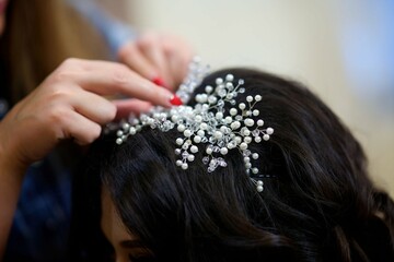 A large beautiful brooch for decorating the head. Jewelry for the bride.