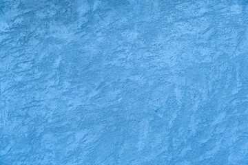 Blue colored cement surface, beton texture, background. Part of the colorful concrete wall. Close up, copy space.