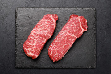 Prime marbled beef steaks. Raw striploin steak