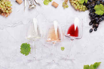 Fototapeta White, rose and red wine glasses and grape obraz