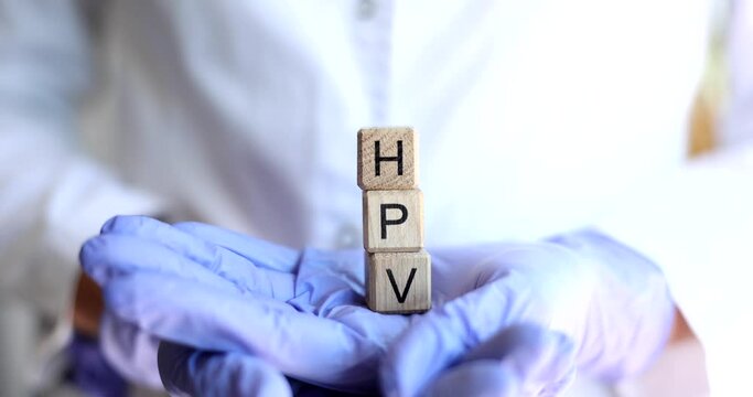 Doctor holds text with inscription HPV human papillomavirus