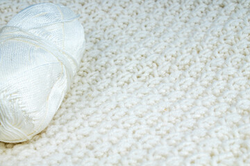 Sweater or scarf fabric texture large knitting. Knitted jersey background with a relief pattern. Wool hand- machine, handmade.