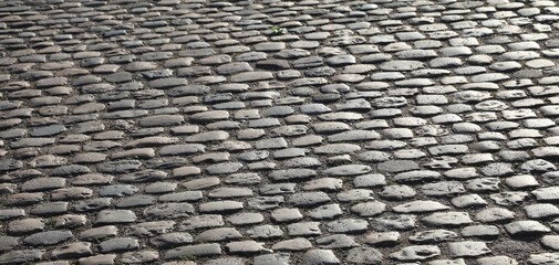 road pavement made with many smooth pebbles without people