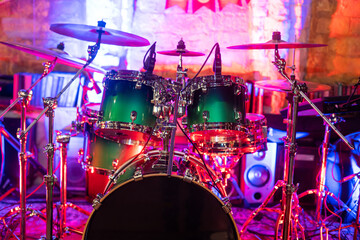 Drum kit on stage in the spotlight color