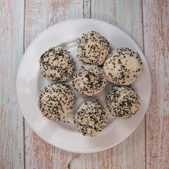 Recipe for sushi ball, rice and tuna, white and black sesame. High quality photo