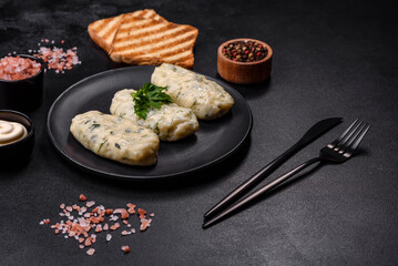 Traditional Lithuanian dish zeppelin, boiled potato dumplings stuffed with minced meat © chernikovatv