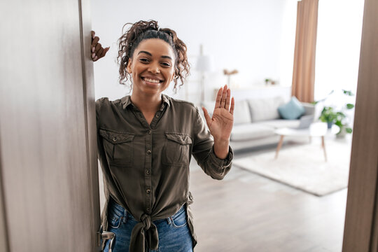 Black Woman Waving Hand Opening Door Meeting You At Home