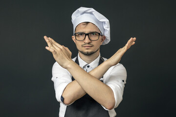 Naklejka premium the chef has his arms crossed in front of him he wants to stop all this. he's had enough