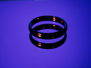 Rings with fire reflection on blue background