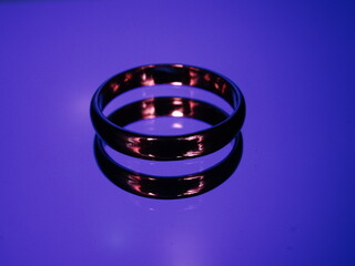 Rings with fire reflection on blue background