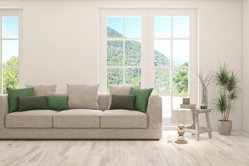 White living room with sofa and summer landscape in window. Scandinavian interior design. 3D illustration