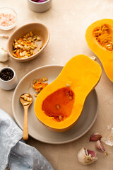 Butternut squash cutted in halves pumpkin, cooking autumn pastry or soup.