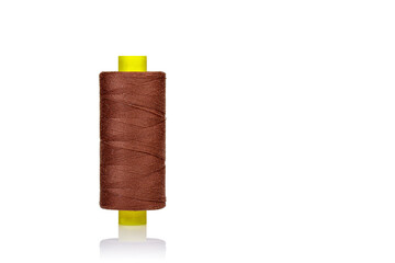 skein of thread brown colors macro on a white background