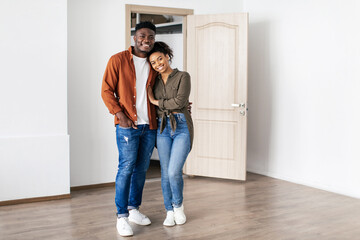Loving Black Spouses Embracing Posing In New Home