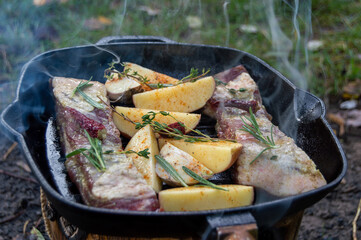 Grilled ribs with garlic peppers and herbs with potato
