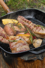 Grilled ribs with garlic peppers and herbs with potato