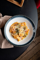 Juicy pasta with rapan cheese and herbs