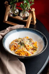 Juicy pasta with rapan cheese and herbs