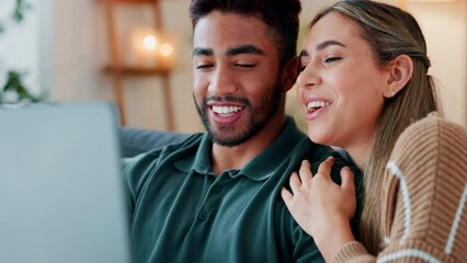 Happy couple with laptop on sofa for real estate inspiration, home ideas and planning for future together. Young interracial people on couch with pc and internet surfing website with house discussion