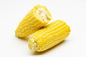 Two halves ear of ripe sweet corn isolated on white background. Isolated. Package design element. Sweet corn without husk. Close-up