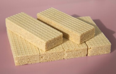 Many crispy wafers biscuit on a pink background - 533749541