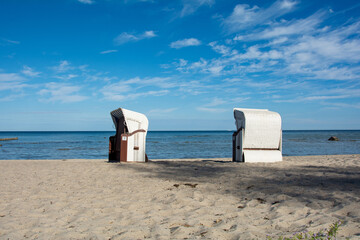 Wicker beach baskets on a sand  beach at the Baltic Sea
