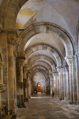 Side aisle with arches of the medieval basilica Sainte-Marie-Madeleine in Vézelay, Burgundy, Morvan, France, a Unesco wold heritage site.
