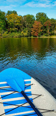 paddleboard on the lake in fall