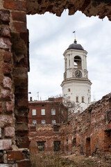 Fototapeta na wymiar clock tower in the city of Vyborg, the bell tower of the destroyed cathedral, April 11, 2022, Vyborg, Russia