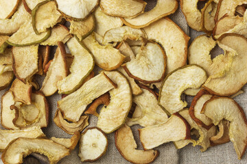 Dried pears lie on canvas. Background