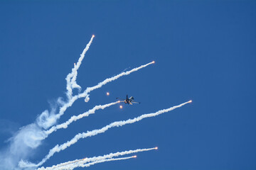Jet plane in the sky Flare show, Airshow 