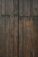 Dark wood boards with nails