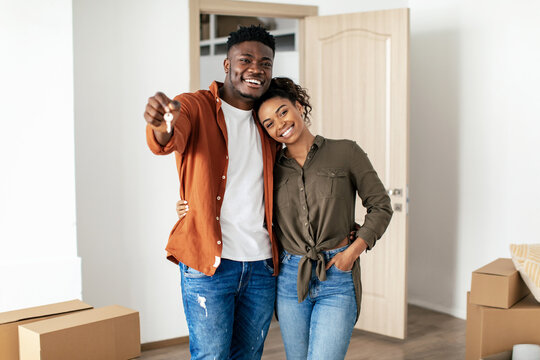 African American Millennial Couple Showing Key Posing In New House