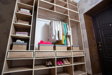 Obraz na płótnie Canvas Big wardrobe with different clothes and accessories in dressing room