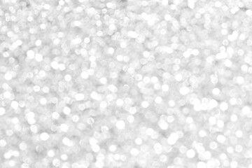Abstract silver and white bokeh light shiny background. The concept of New Year, Christmas, Wedding anniversary, Winter and all celebration background concepts.