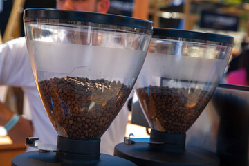 Coffee grains in a glass lantern, coffee grinder.